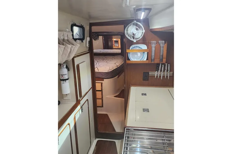 Slide: The Image of Interior of 1987 Irwin 44 sailboat with cozy cabin and organized kitchen area. - 25