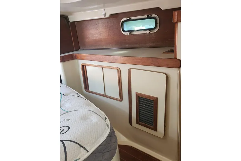 Slide: The Image of Interior of 1987 Irwin 44 sailboat with wood accents and porthole. - 30