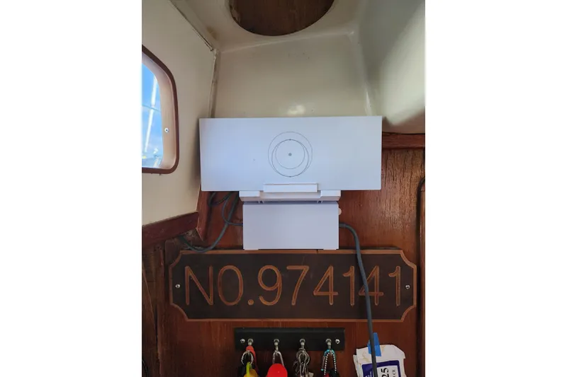 Slide: The Image of Interior of 1987 Irwin 44 sailboat with equipment and registration number. - 38