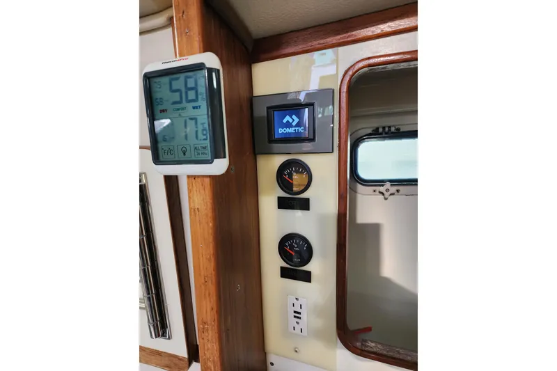 Slide: The Image of Control panel inside 1987 Irwin 44 yacht with digital and analog gauges. - 41