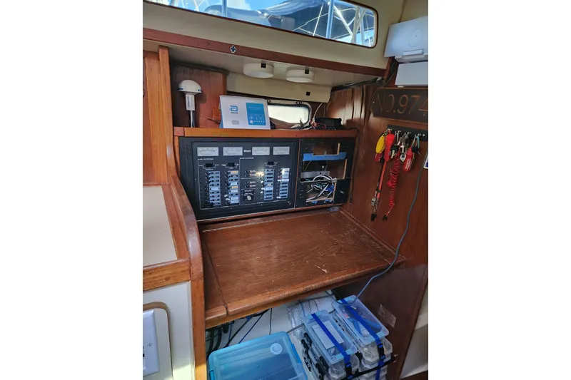 Slide: The Image of Electrical panel inside 1987 Irwin 44 sailboat, featuring organized wiring and control switches. - 46