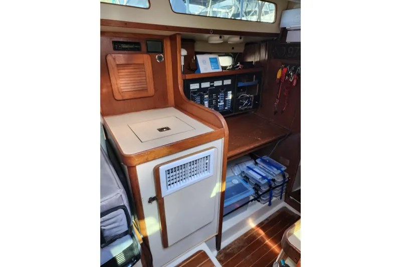 Slide: The Image of 1987 Irwin 44 yacht interior with navigation station and storage. - 47