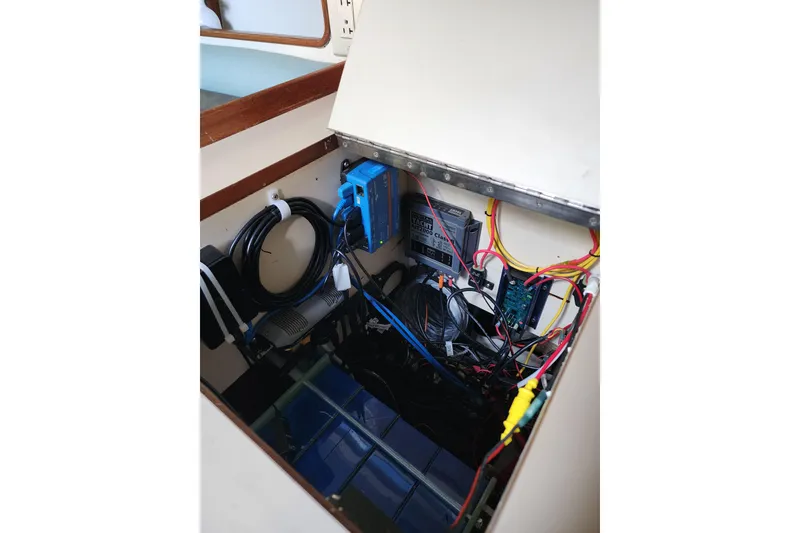 Slide: The Image of Electrical system inside 1987 Irwin 44 sailboat, featuring wiring and components. - 48