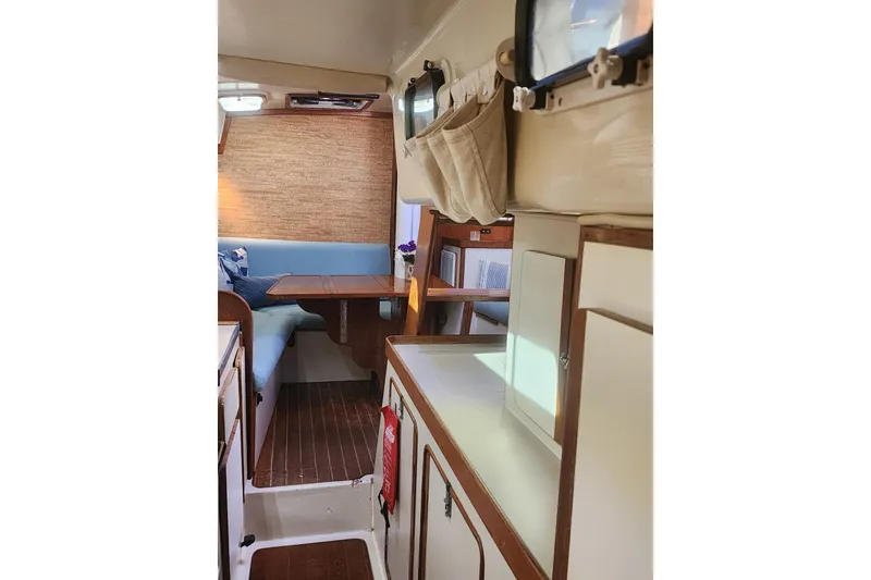 Slide: The Image of Interior of 1987 Irwin 44 sailboat with cozy seating and wooden accents. - 55