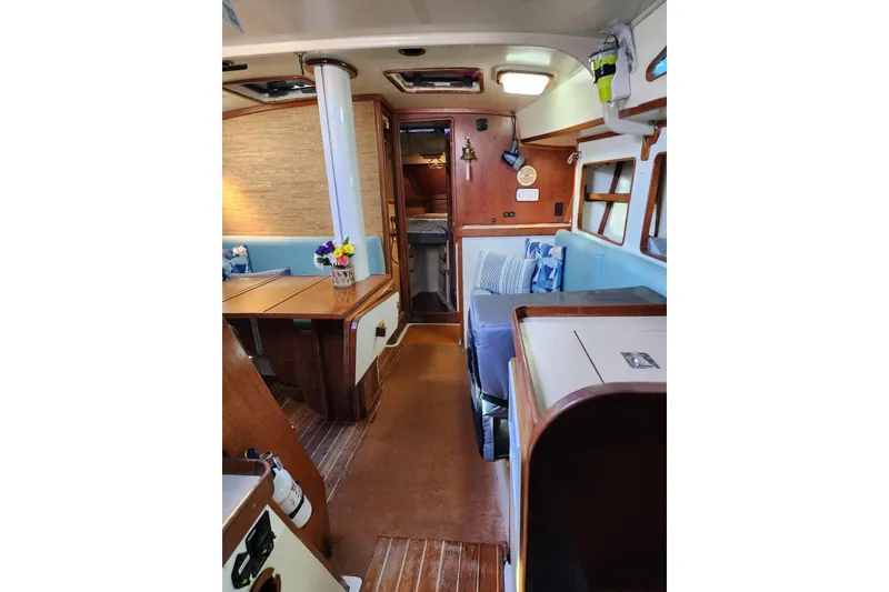 Slide: The Image of Interior of 1987 Irwin 44 sailboat with cozy seating and wooden finishes. - 57