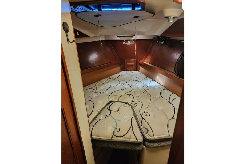 Slide: The Image of Cozy cabin interior of 1987 Irwin 44 sailboat with patterned mattress. - 60