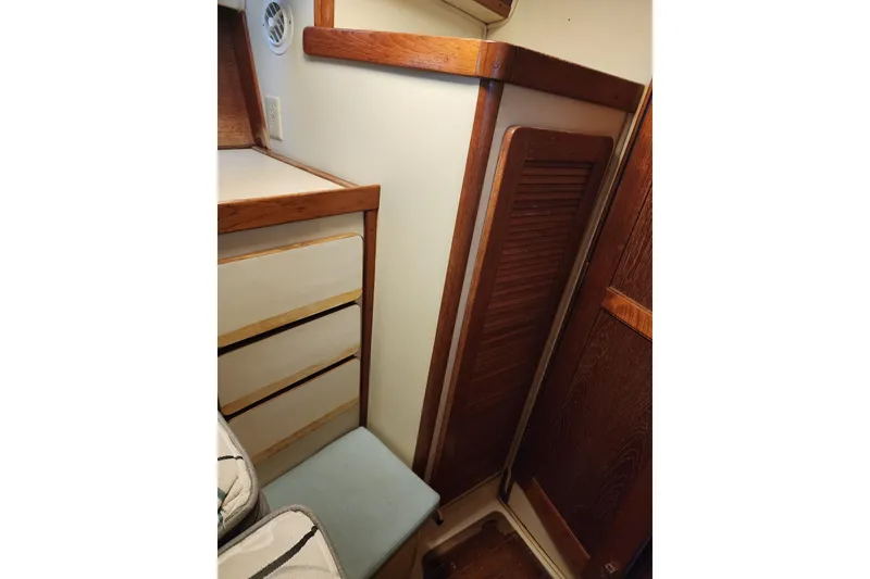 Slide: The Image of Interior of 1987 Irwin 44 sailboat with wooden cabinetry and seating. - 64