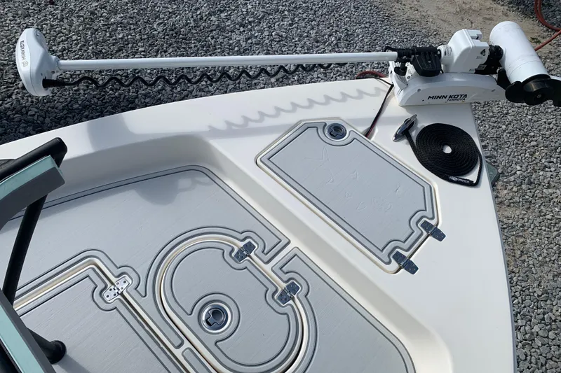 Slide: The Image of 2017 Pathfinder 2400 TRS boat deck with Minn Kota trolling motor and storage compartments. - 10