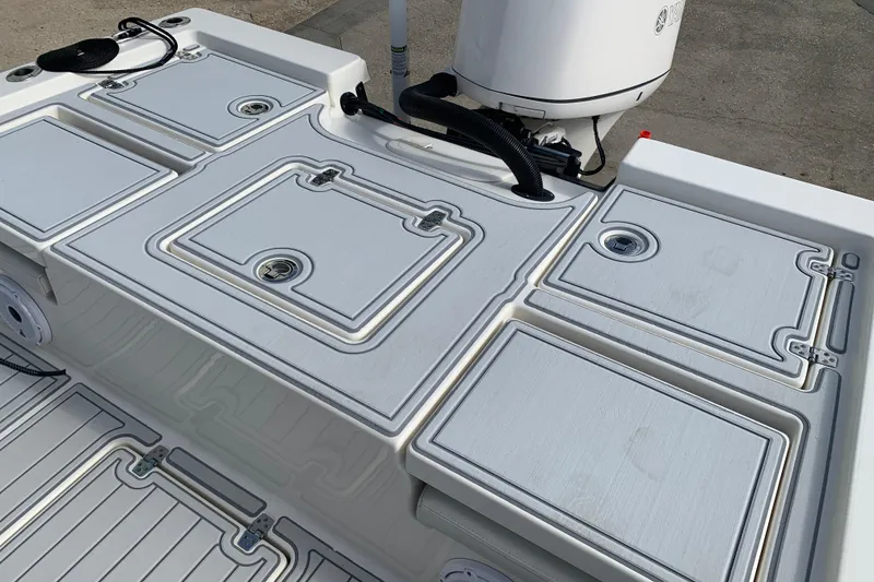 Slide: The Image of 2017 Pathfinder 2400 TRS boat deck with storage compartments and motor. - 13