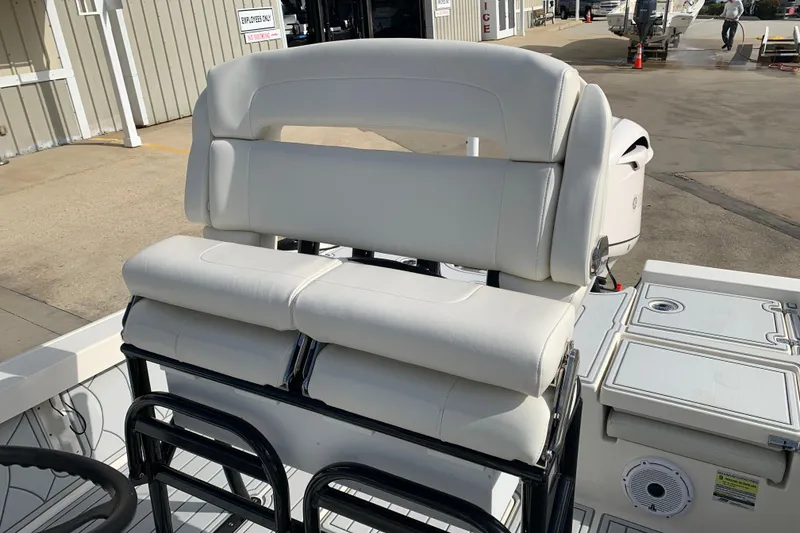 Slide: The Image of 2017 Pathfinder 2400 TRS boat with white cushioned seating and sleek design. - 17