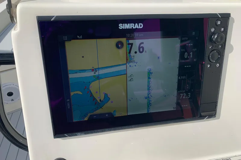 Slide: The Image of Simrad navigation display on 2017 Pathfinder 2400 TRS boat, showing depth and water temperature. - 19