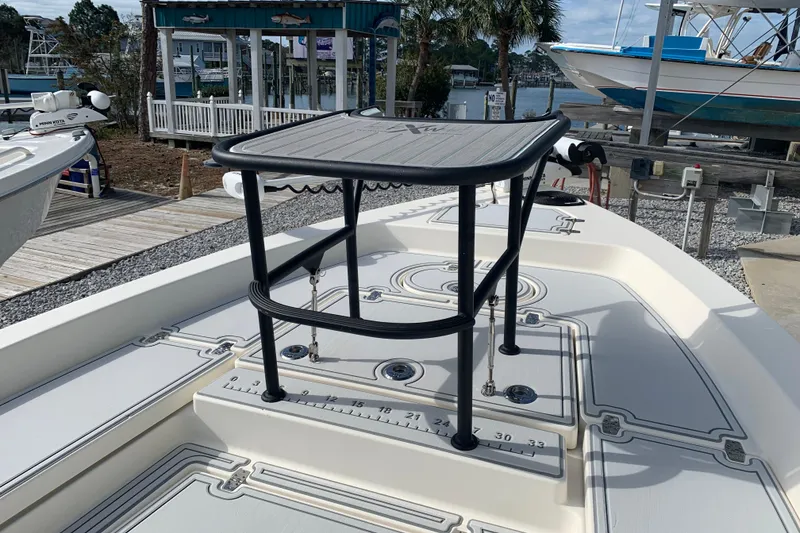 Slide: The Image of 2017 Pathfinder 2400 TRS boat deck with elevated platform, docked near marina. - 9