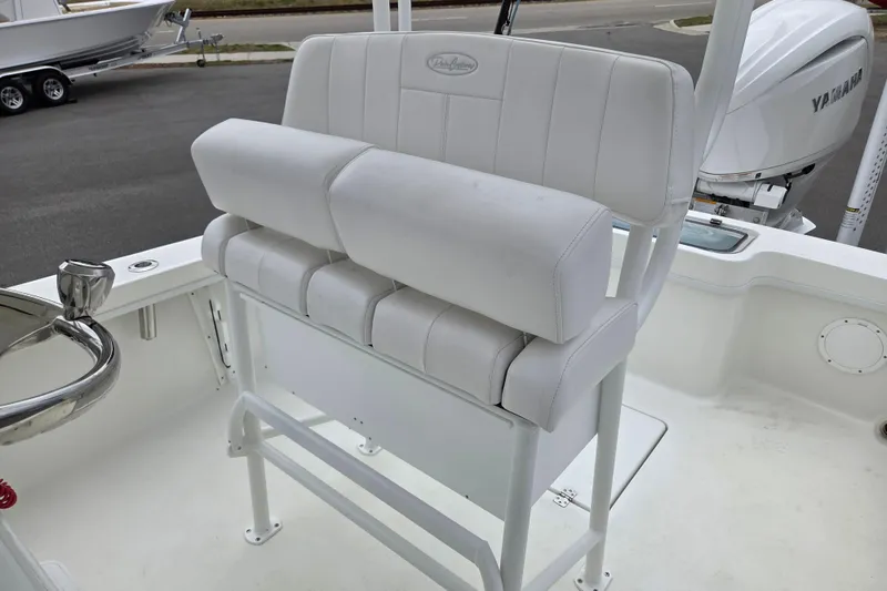 Slide: The Image of 2026 Pair Customs 21 Center Console MV boat with white cushioned seating and Yamaha engine. - 11