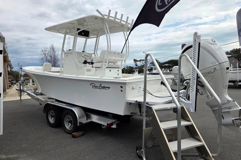 Slide: The Image of 2026 Pair Customs 21 Center Console MV boat on trailer with Yamaha engine. - 4