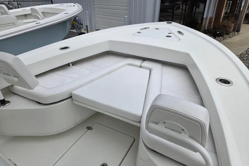 Slide: The Image of 2026 Pair Customs 21 Center Console MV boat with white cushioned seating. - 6