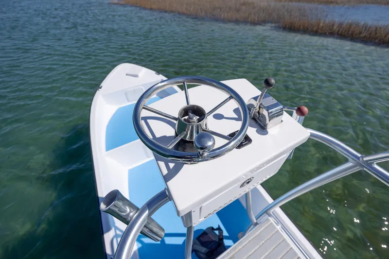 Slide: The Image of 2021 Imemsa W25BA boat steering console on calm water. - 10