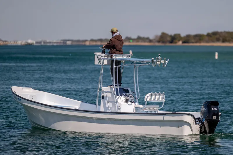 Slide: The Image of 2021 Imemsa W25BA boat with Suzuki engine on calm water. - 4