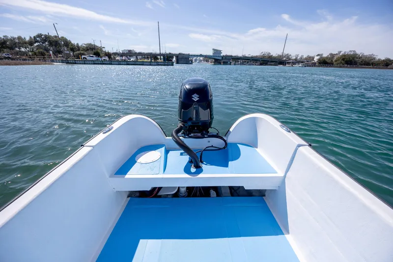 Slide: The Image of 2021 Imemsa W25BA boat on water, featuring a Suzuki outboard motor. - 7
