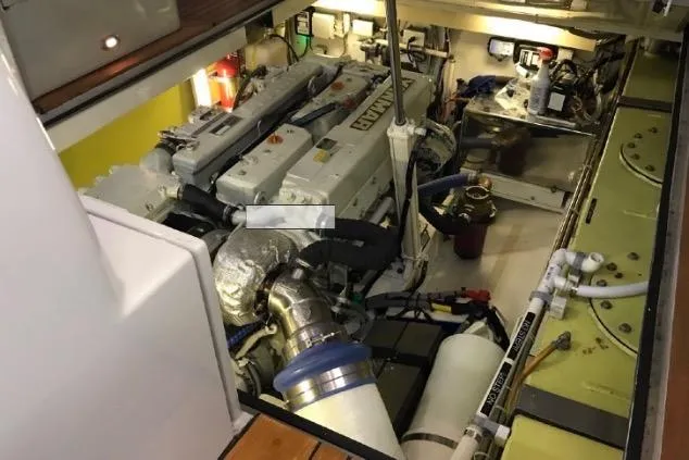 Slide: The Image of Engine room of 2005 Lyman-Morse Monhegan yacht, showcasing mechanical components and systems. - 21