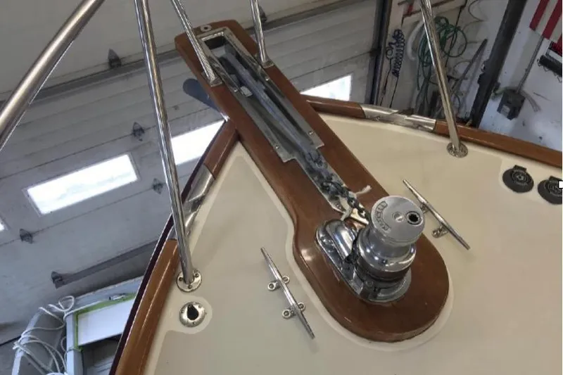 Slide: The Image of Bow of 2005 Lyman-Morse Monhegan yacht with winch and cleats in a workshop. - 8