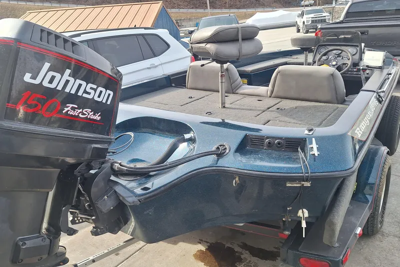Slide: The Image of 1994 Ranger 481VS boat with Johnson 150 Fast Strike outboard motor, parked on trailer. - 3