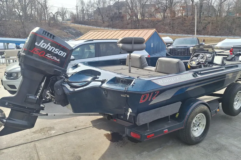 Slide: The Image of 1994 Ranger 481VS boat with Johnson 150 Fast Strike outboard motor on trailer. - 4