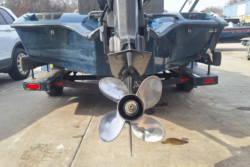 Slide: The Image of 1994 Ranger 481VS boat on trailer, showing rear view with propeller. - 9