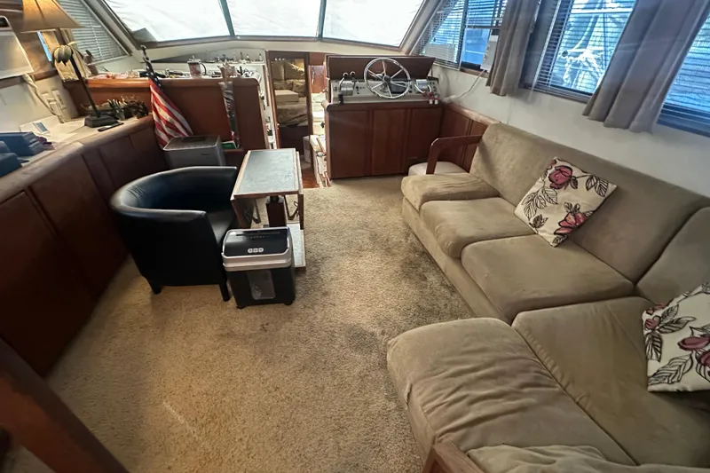 Slide: The Image of Interior of 1991 Carver Californian 48 yacht with cozy seating and helm station. - 30