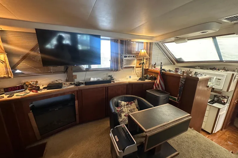 Slide: The Image of Interior of 1991 Carver Californian 48 yacht with TV, seating, and decor. - 40