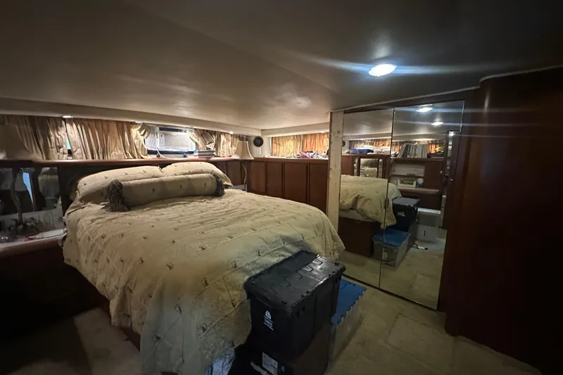 Slide: The Image of Luxurious bedroom interior of 1991 Carver Californian 48 yacht with mirrored closet. - 57