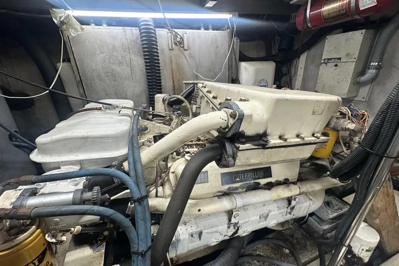 Slide: The Image of Engine room of 1991 Carver Californian 48 yacht with Caterpillar engine. - 62