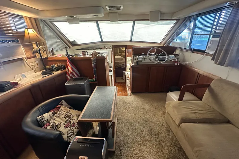 Slide: The Image of Interior of 1991 Carver Californian 48 yacht with cozy seating and helm station. - 39