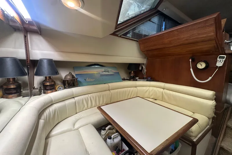 Slide: The Image of Interior of 1991 Carver Californian 48 yacht with cozy seating and nautical decor. - 45