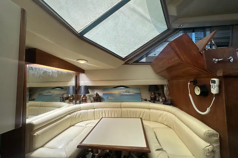 Slide: The Image of Interior of 1991 Carver Californian 48 yacht with leather seating and skylight. - 46