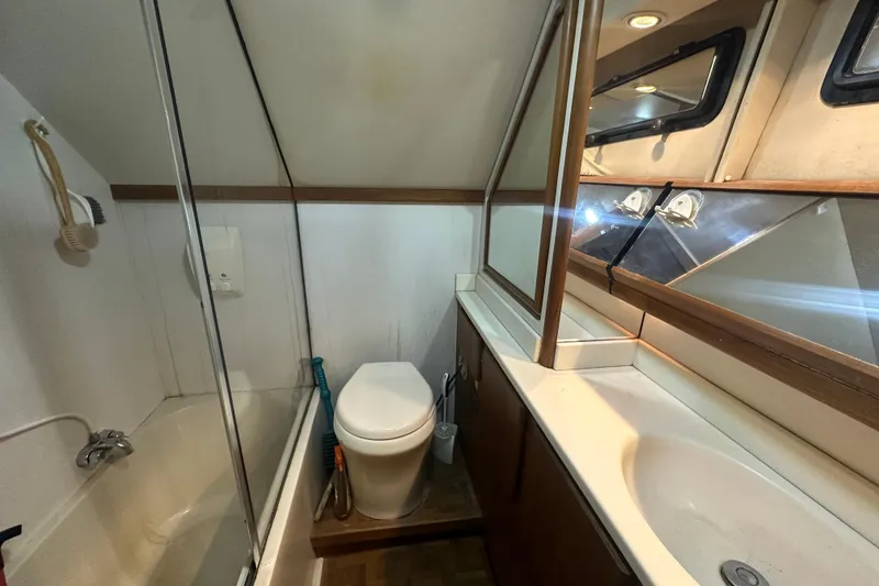 Slide: The Image of Bathroom interior of 1991 Carver Californian 48 yacht with shower, toilet, and sink. - 60