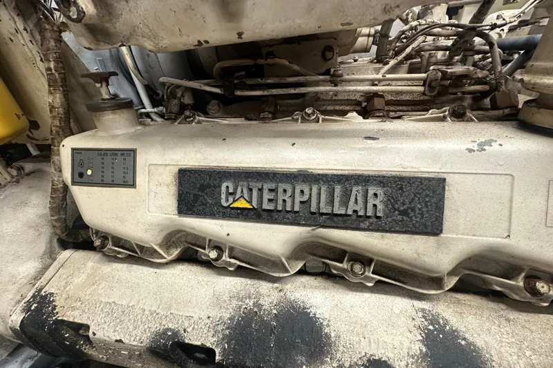 Slide: The Image of Caterpillar engine in a 1991 Carver Californian 48 yacht, showcasing mechanical details. - 61