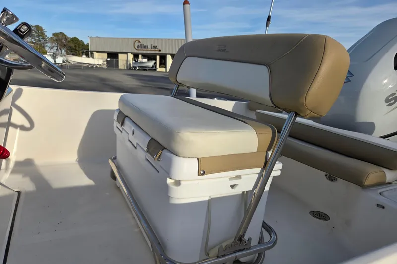 Slide: The Image of 2020 Pioneer 180 Islander boat interior with cushioned seating and steering wheel. - 12