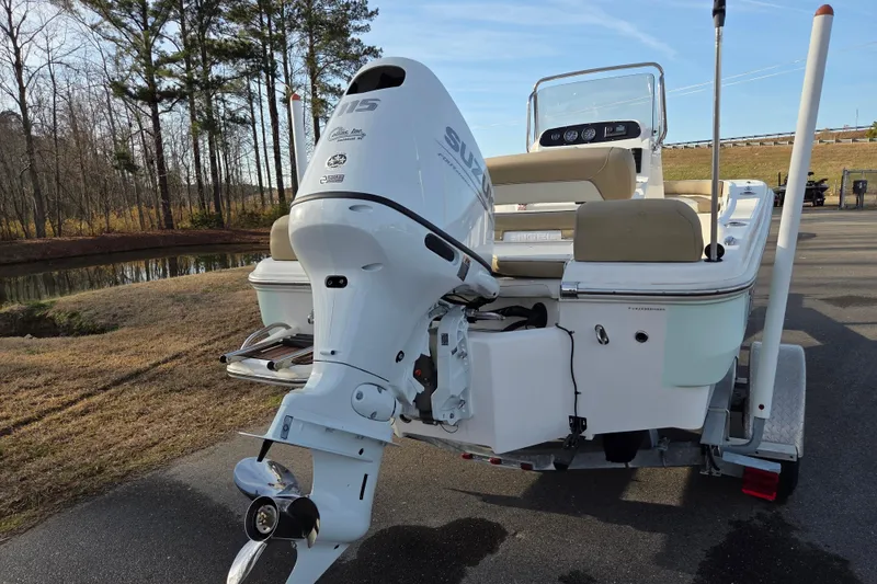 Slide: The Image of 2020 Pioneer 180 Islander boat with Suzuki outboard motor on a trailer. - 3