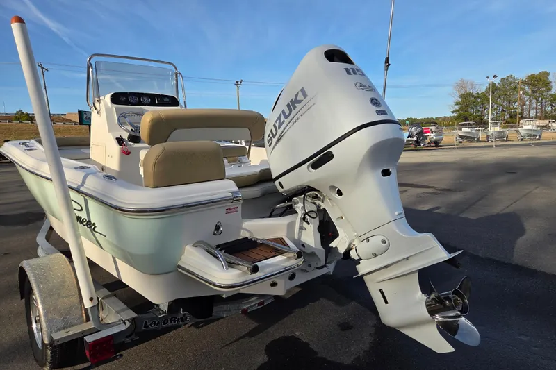 Slide: The Image of 2020 Pioneer 180 Islander boat with Suzuki outboard motor on a trailer. - 4