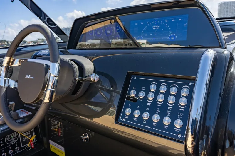 Slide: The Image of 2025 Riva 33' Aquariva Special dashboard with modern controls and digital display. - 11