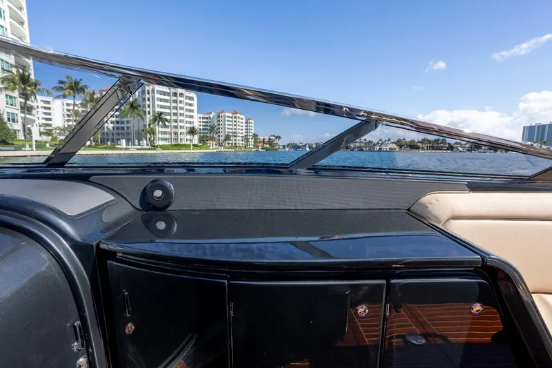 Slide: The Image of Interior view of 2025 Riva 33' Aquariva Special yacht with waterfront cityscape. - 14