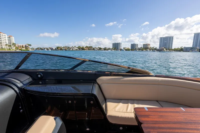 Slide: The Image of 2025 Riva 33' Aquariva Special yacht interior with waterfront cityscape view. - 16