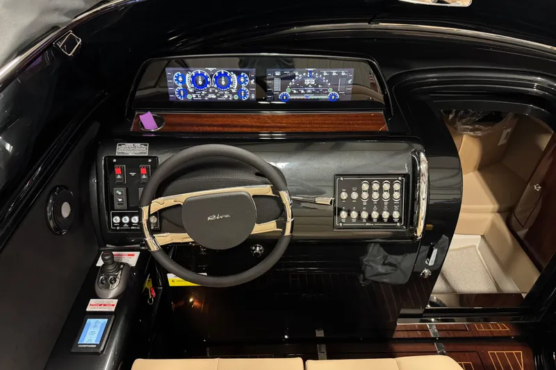 Slide: The Image of 2025 Riva boat dashboard with advanced controls and digital displays. - 3
