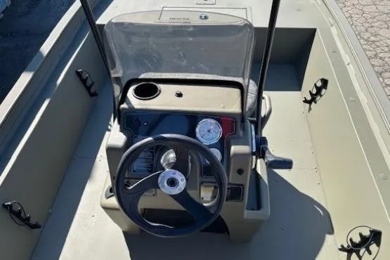 Slide: The Image of 2026 Tracker Grizzly 1860 CC boat console with steering wheel and gauges. - 8