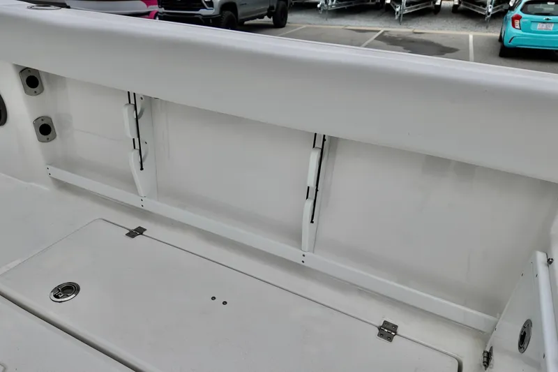 Slide: The Image of 2026 Sea Fox 268 Commander boat interior, featuring storage compartments and rod holders. - 10