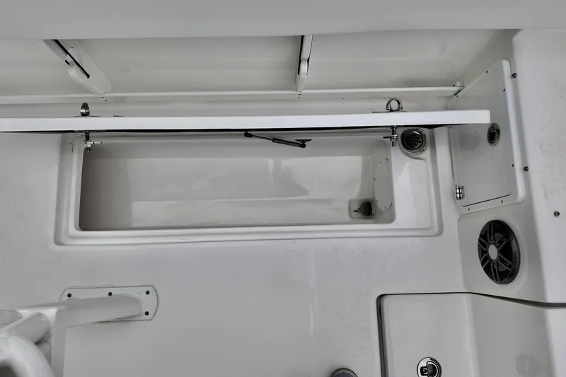 Slide: The Image of 2026 Sea Fox 268 Commander boat interior, featuring storage compartment and speaker. - 12