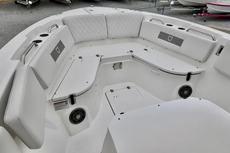 Slide: The Image of 2026 Sea Fox 268 Commander boat interior with cushioned seating and cup holders. - 17