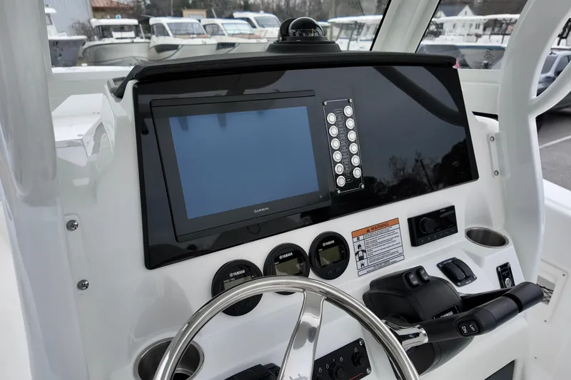Slide: The Image of 2026 Sea Fox 268 Commander dashboard with Garmin display and controls. - 20