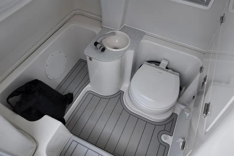 Slide: The Image of 2026 Sea Fox 268 Commander boat bathroom with toilet and sink. - 8