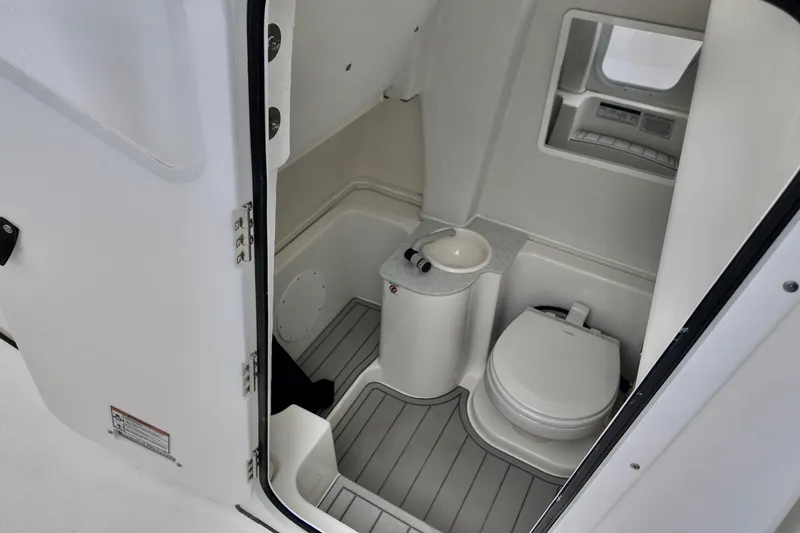 Slide: The Image of 2026 Sea Fox 268 Commander boat interior bathroom with toilet and sink. - 9